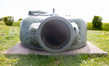 Barrel of a dug in Sherman tank in the Netherlands, used in the cold warの写真素材
