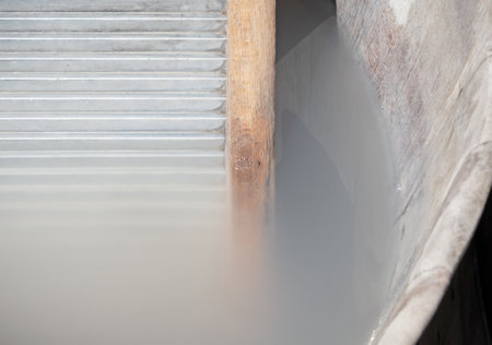 Closeup of a vintage washing board, still in use, selective focusの写真素材