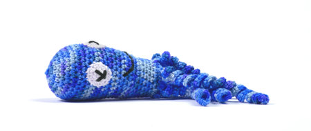 Crochet squid or octopus, isolated on whiteの写真素材