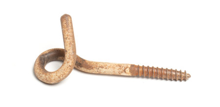 Rusty hook for hanging something in the ceiling, close-up, isolated