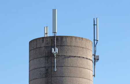 Round tower with equipment sending out wireless internet, blue sky