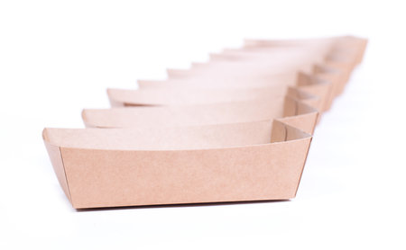 Recycled paper trays for snacks, isolated on a white backgroundの写真素材