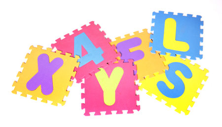 Alphabet puzzle pieces isolated on a white backgroundの写真素材