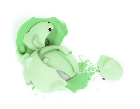 Hammer breaking piggy bank isolated on whiteの写真素材