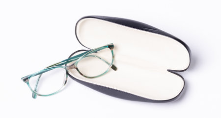 Pair of classics eyeglasses in case isolated on white backgroundの写真素材