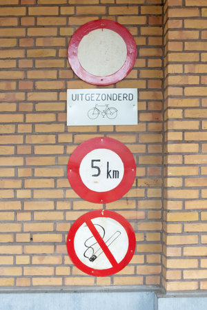 Old sigs saying no entry (except bicycles, no smoking an 5 kph, Antwerp, Belgiumの写真素材