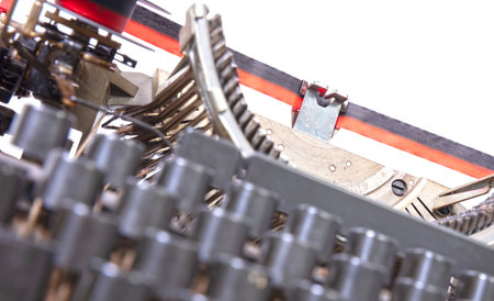Broken metal typewriter, vintage object isolated, full frame