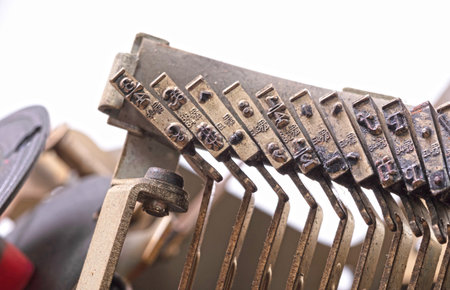 Broken metal typewriter, vintage object isolated, full frame