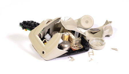 Part of a broken old telephone, phone with dial plate - plastic phone, isolatedの写真素材