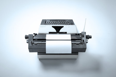Broken metal typewriter, vintage object isolated, full frame