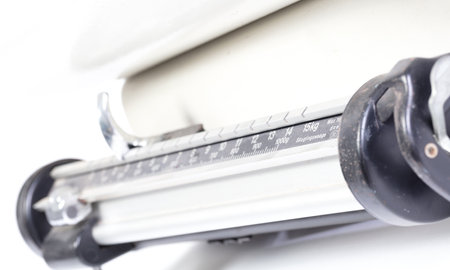 Part of broken baby weight scales, isolated on whiteの写真素材