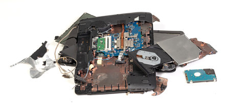 Old broken laptop isolated on white a background