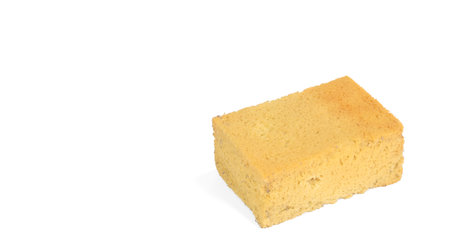 Old yellow sponge for cleaning, isolated on white
