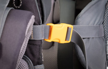 Yellow plastic clasp of backpack, full frame image