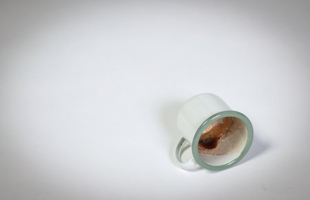 Dirty coffee mug isolated on a white backgroundの写真素材
