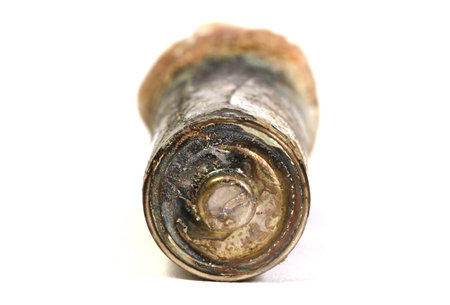 Unbranded corroded alkaline battery leaking potassium hydroxide, isolated