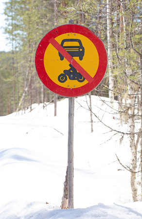 Sign next to a forest road in Finland saying 'no motorized vehicles', selective focusの写真素材