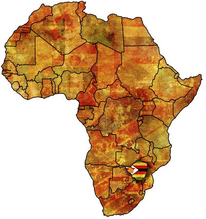 some very old grunge map with flag of zimbabweの写真素材