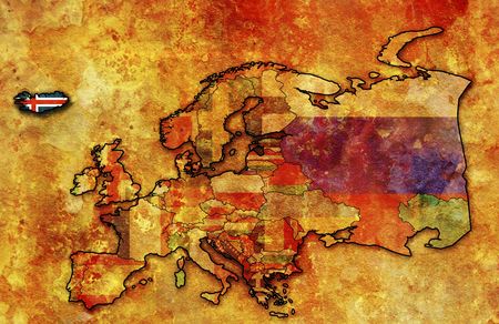 some very old grunge map of iceland with flag on map of europeの写真素材