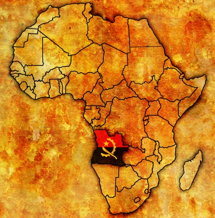 angola on actual vintage political map of africa with flagsの写真素材