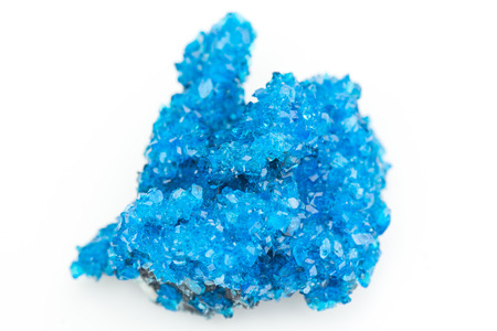 detailed macro photo of Chalcanthite mineral isolated over whiteの写真素材