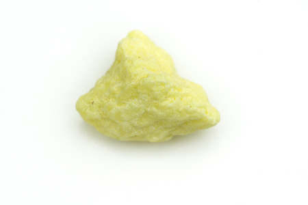 detailed macro photo of sulfur mineral isolated over whiteの写真素材