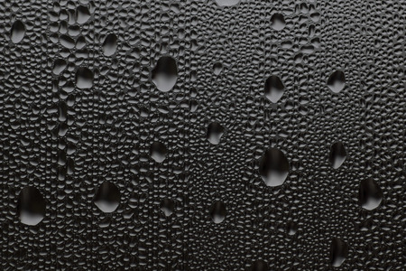macro photo of water drops on a window glass