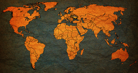 ukraine flag on old vintage world map with national bordersの写真素材