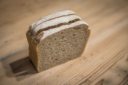 detail of sliced bread on wooden table