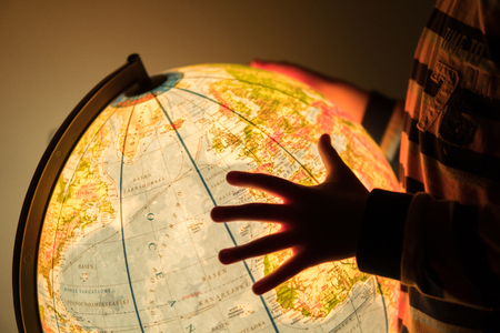 looking for a location on an earth model mapの写真素材