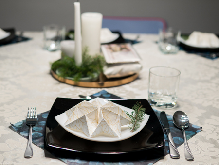 elegant table setting with decoration for dinner in regular home