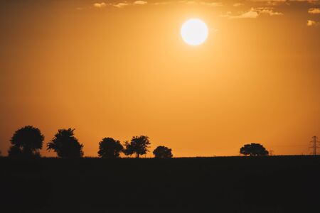 silhouette evening landscape of rural area during sunset の写真素材