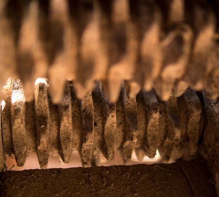 detail of old vintage machine made from wood and metal cogwheelの写真素材