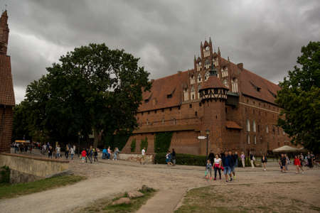 august 2019, Malbork, Poland: tourists walking in front of malbork castle