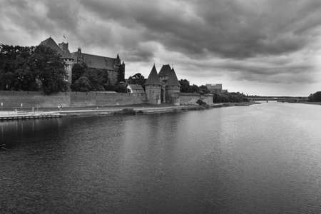 august 2019, Malbork, Poland: view on walls and towers of a Malbork castle over a Noagt river
