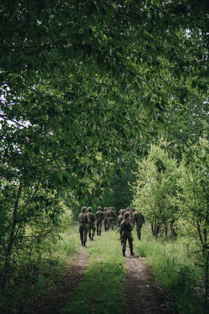 young soldiers patrolling a forest during training