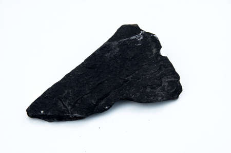 dark basalt rock isolated over white backgroundの写真素材
