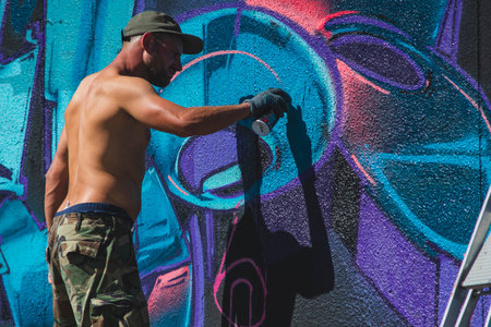 August 7, 2022, Lublin, Poland: Meeting of Styles - graffiti jam. Artist creating street art on the wallsのeditorial素材