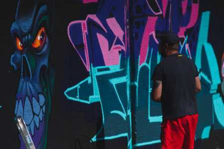 August 7, 2022, Lublin, Poland: Meeting of Styles - graffiti jam. Artist creating street art on the wallsのeditorial素材