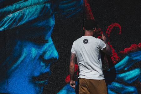 August 7, 2022, Lublin, Poland: Meeting of Styles - graffiti jam. Artist creating street art on the wallsのeditorial素材