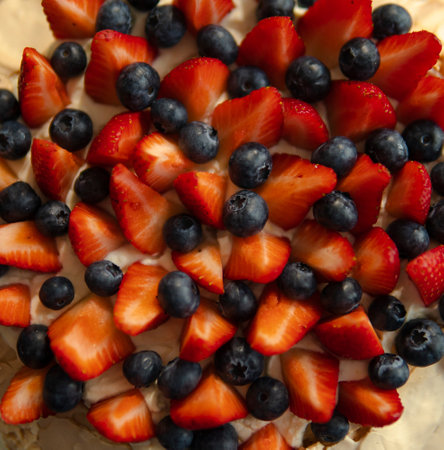 healthy cake with blueberries and strawberriesの写真素材