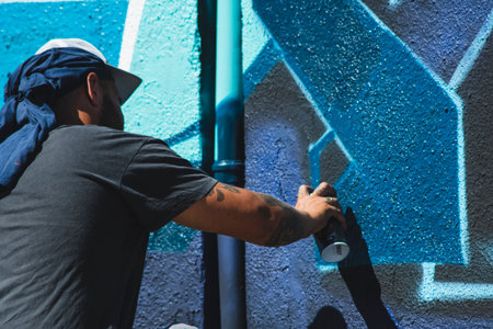 August 7, 2022, Lublin, Poland: Meeting of Styles - graffiti jam. Artist creating street art on the wallsのeditorial素材