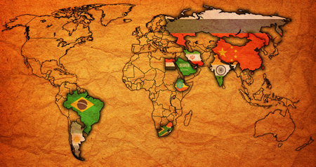 BRICS member countries and candidates flags on political world map with national bordersの写真素材