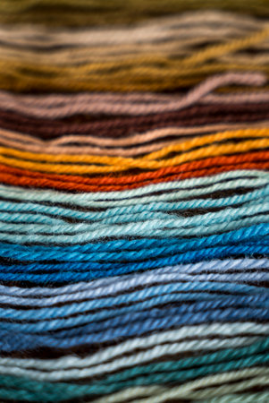 Close up of vibrant created from wool yarn in different colorsの写真素材