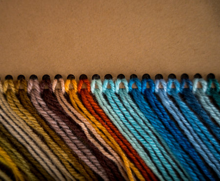 Close up of vibrant created from wool yarn in different colors
