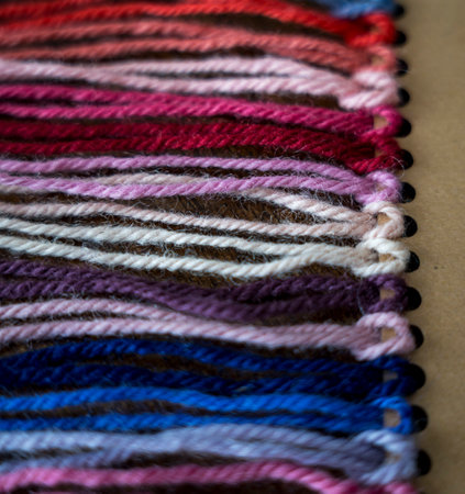 Close up of vibrant created from wool yarn in different colorsの写真素材