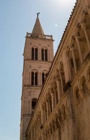 Bell tower on the side of Cathedral of St. Anastasia in the city of Zadar in Croatiaの写真素材