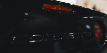 Detail of an emblem of Corvette on a hood of a black car