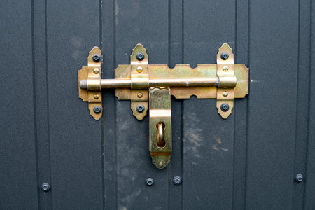Detail of closed garage doors with a boltの写真素材