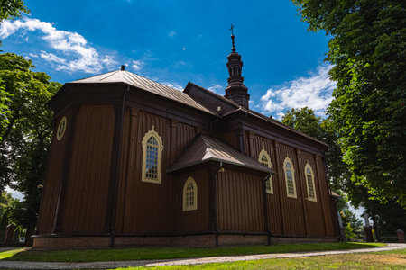 Old wooden church in Poland with ornate windowsの写真素材